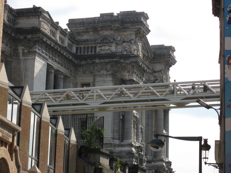 The building seen in the back of the bridge is the Law Courts of Brussels.